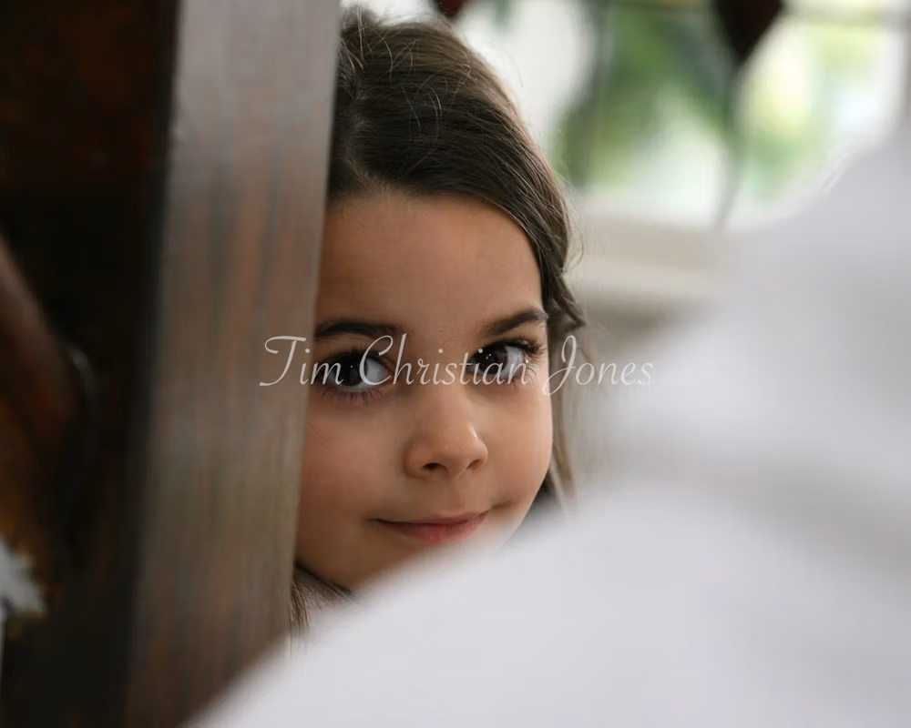 Bride's young daughter photographed during the wedding preparation session