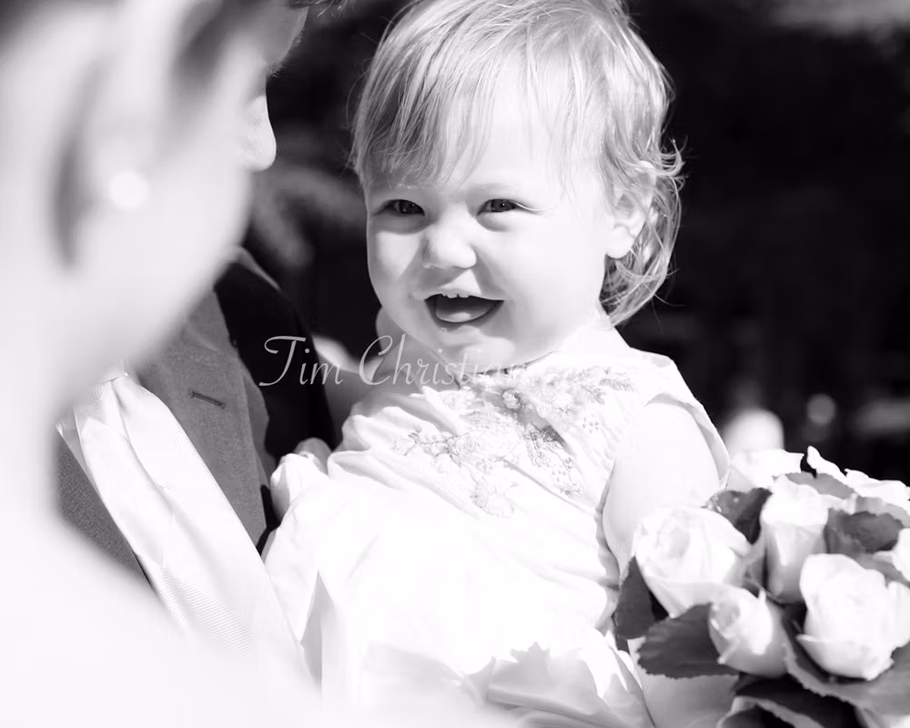 Bride's daughter smiling at her mom