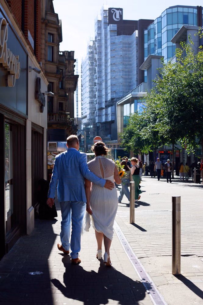 Gemma and Danny walking from their Civic Hall, Leeds wedding to the Lost and Found Leeds Club for their reception.