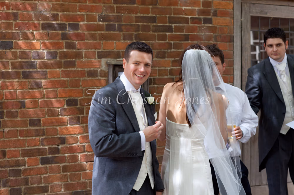 Candid shot of Tim smiling toward the camera in reportage style