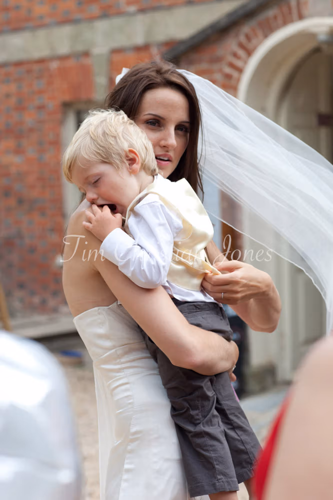 Lowri holds her sleepy son in her arms, a quiet moment together