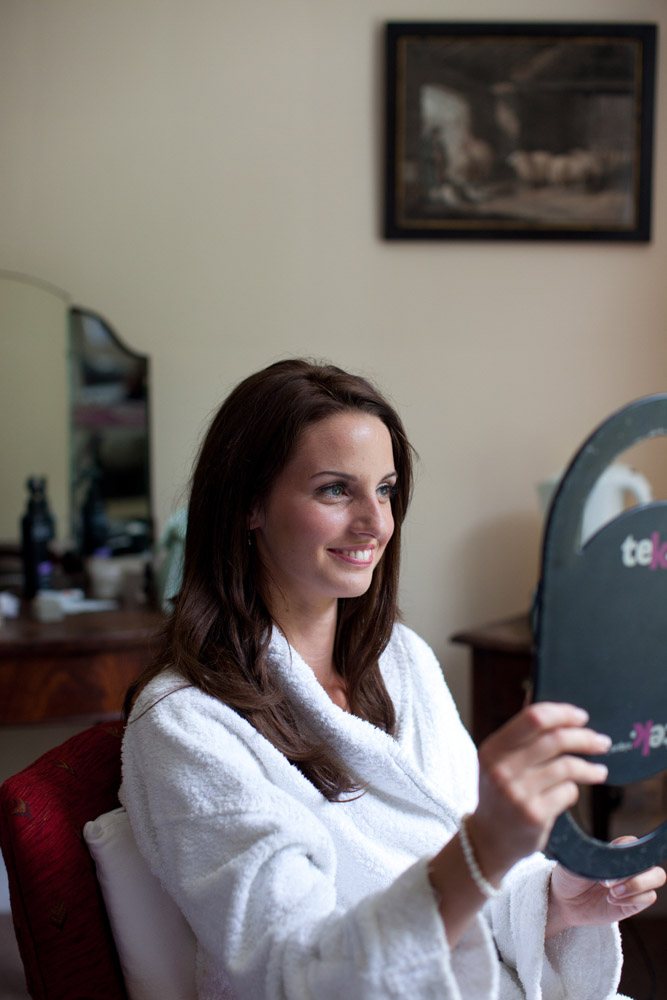 Bride smiles at her make up result