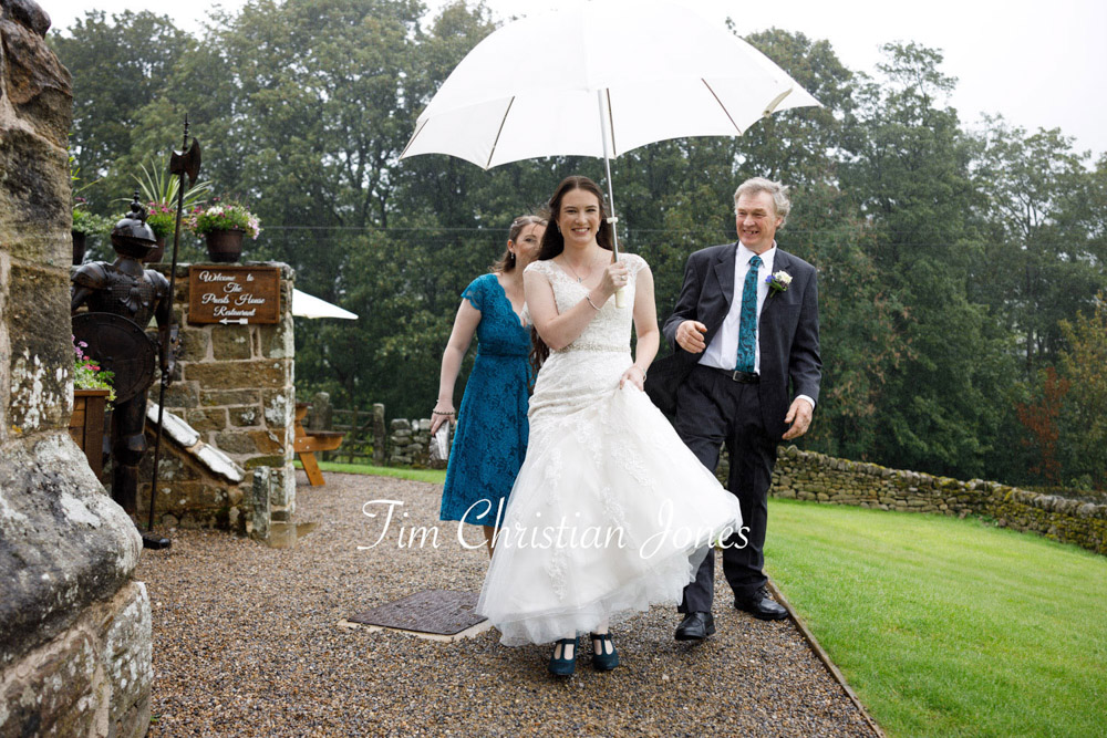 Yorkshire Wedding Romance at The Priest’s House – Jane & Callum 8 008 bride father bridesmaid under umbrella walking to ceremony jc