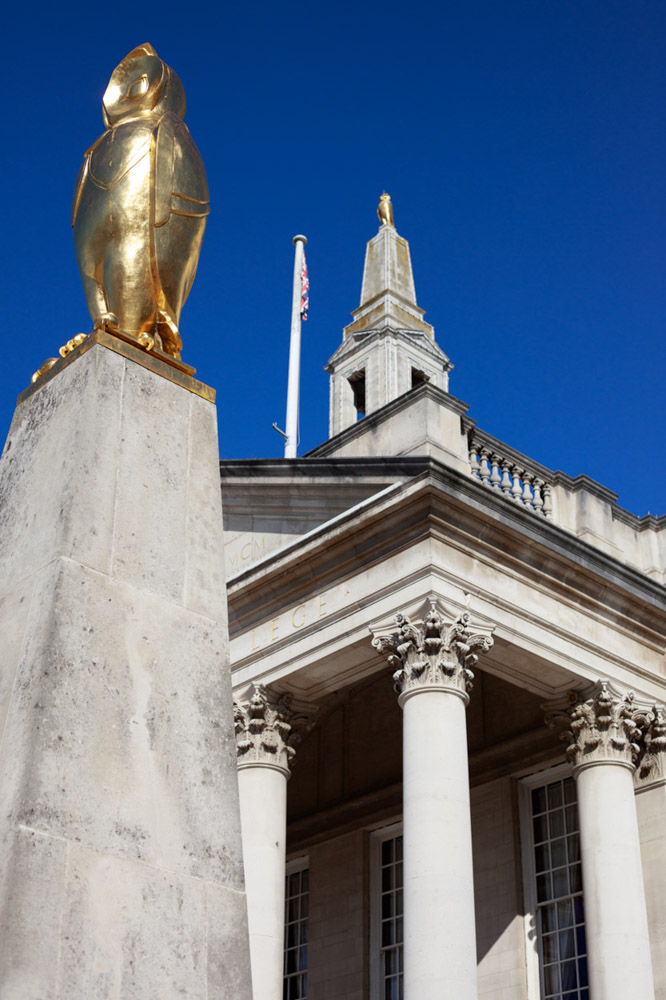 Civic Hall Leeds Wedding Photographer | Golden owl glistening atop Leeds Civic Hall against a clear blue sky