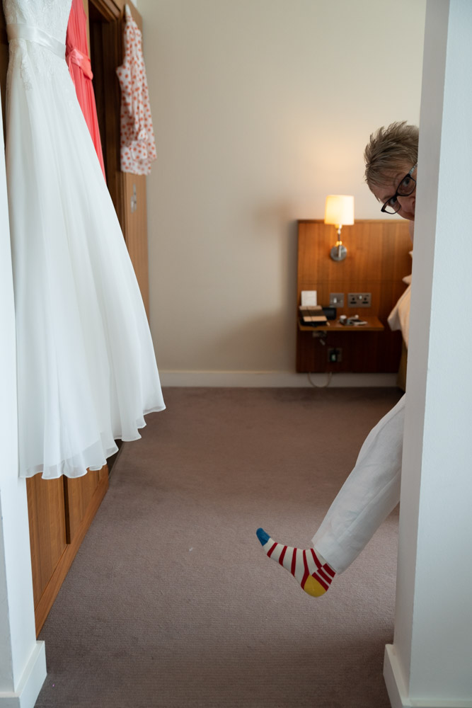 Tracey’s colourful socks peeking from behind a doorway