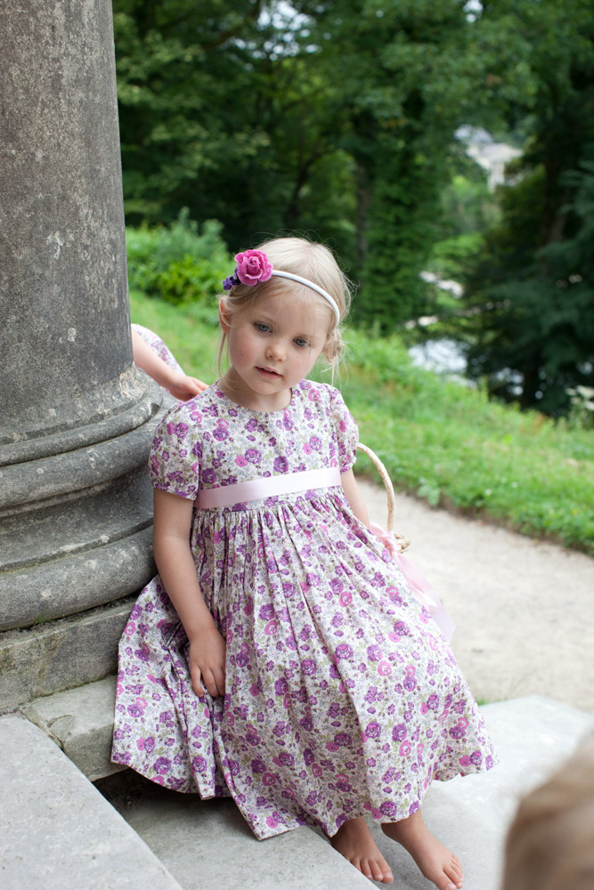 Bridesmaid leant against the temple column