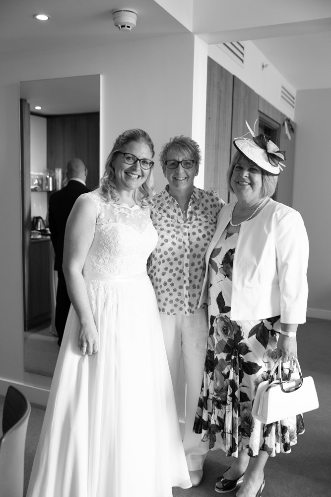 Black and white portrait of Clare, Tracey, and Clare’s mum smiling