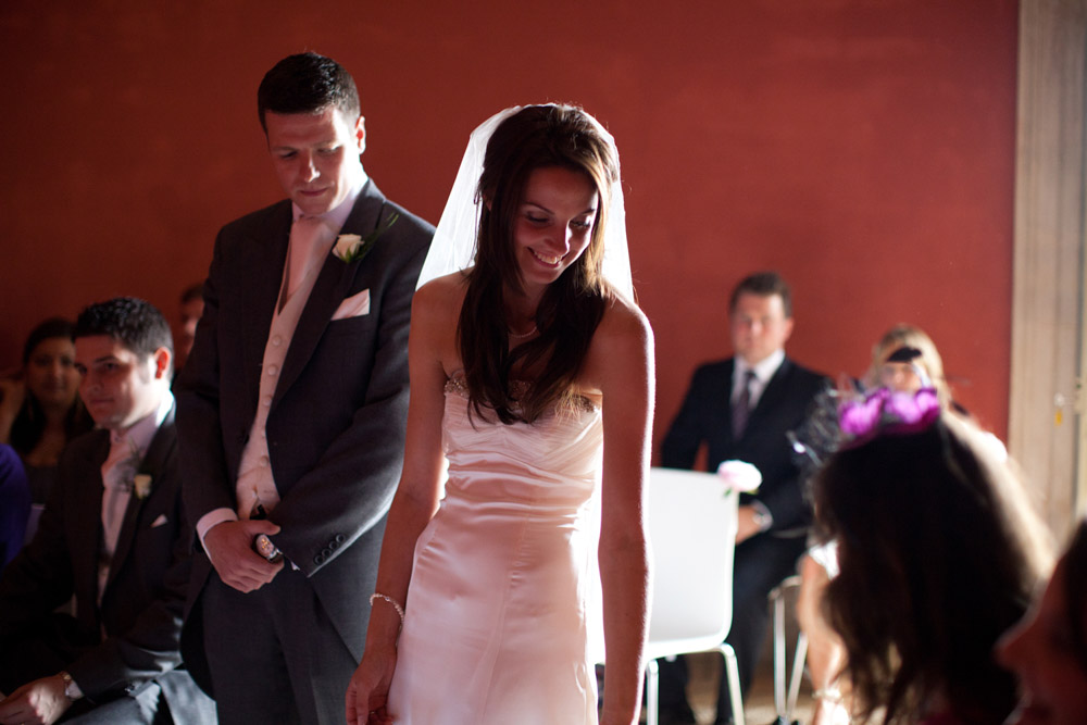 Bride passes her bouquet
