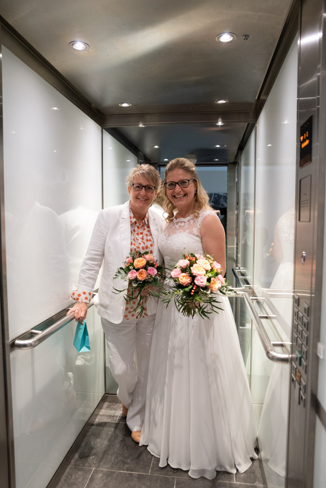 Clare and Tracey heading down in the lift before the wedding
