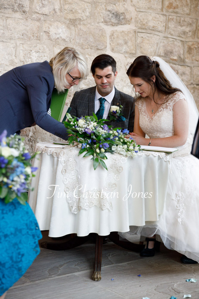 Yorkshire Wedding Romance at The Priest’s House – Jane & Callum 19 019 couple signing the wedding register jc