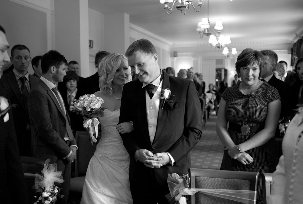 Dani and her father continue walking in black and white