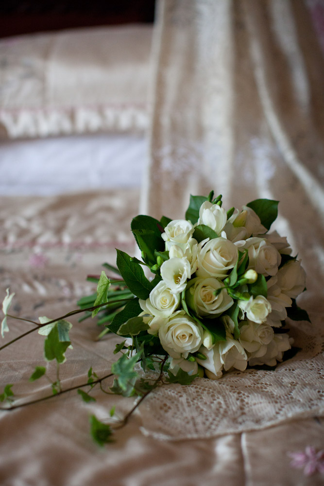 Details captured - the bridal bouquet on the 4 post bed - West Yorkshire wedding photographer