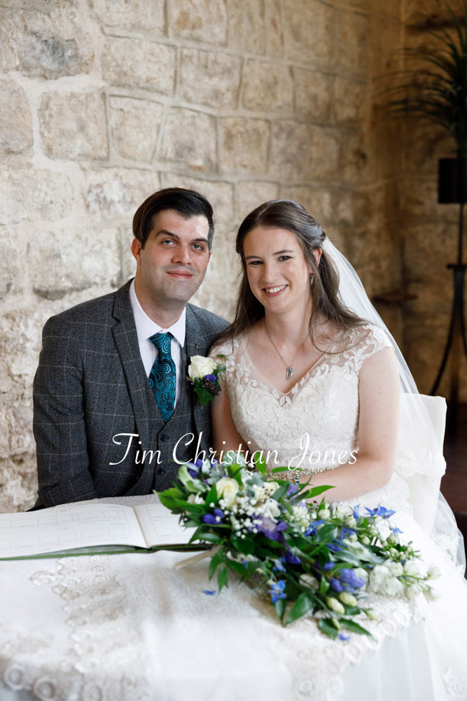 Yorkshire Wedding Romance at The Priest’s House – Jane & Callum 22 022 couple smiling for camera wedding register table jc