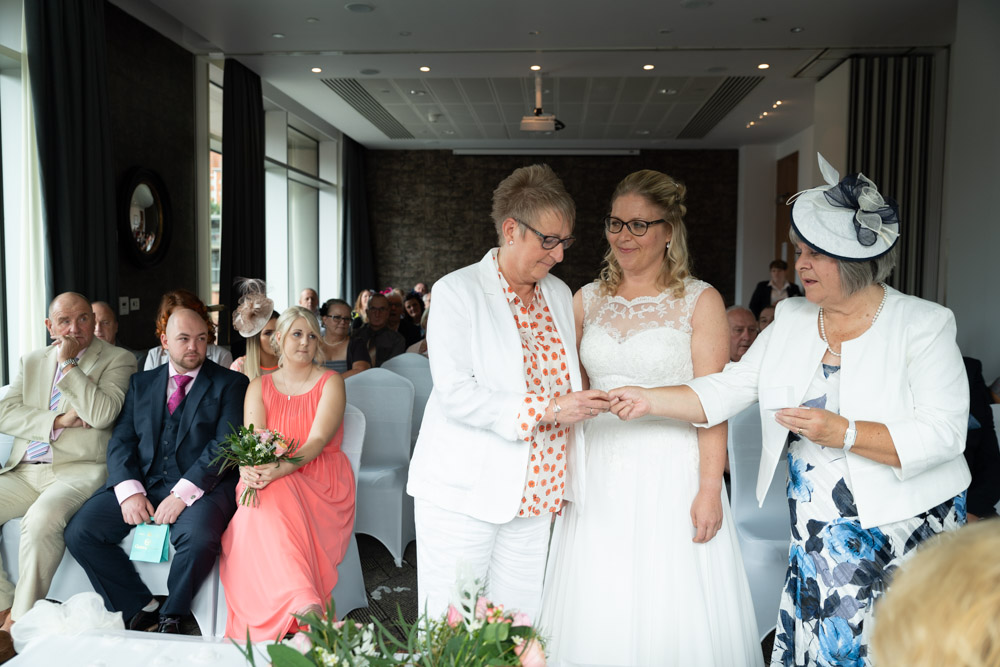 Tracey receiving Clare’s wedding ring during the ceremony