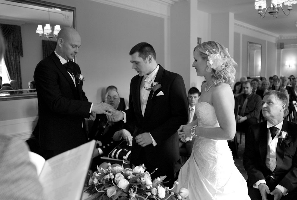 Best man passes Dani’s wedding ring to Scott at Hoyle Court