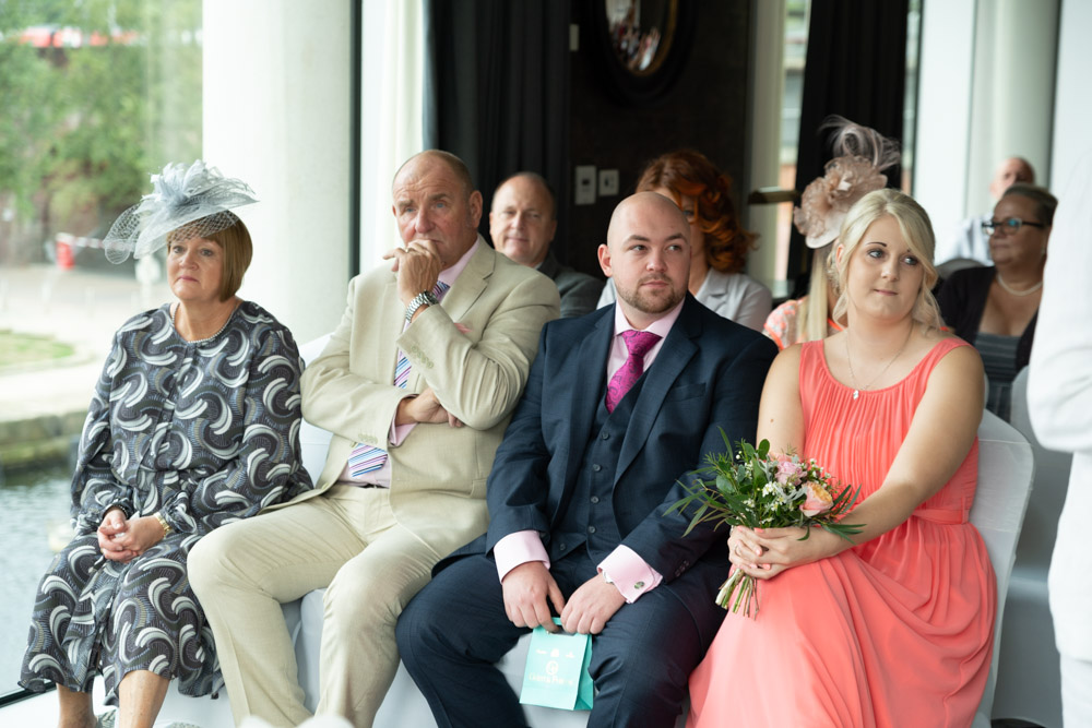 Front row guests watching the wedding ceremony