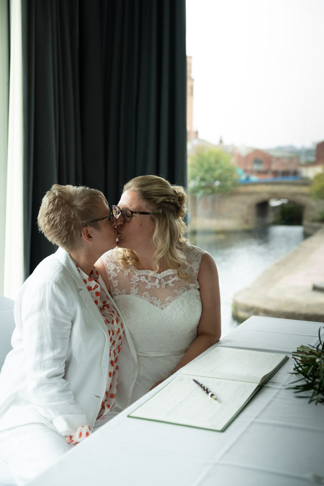 The newlyweds share another soft kiss