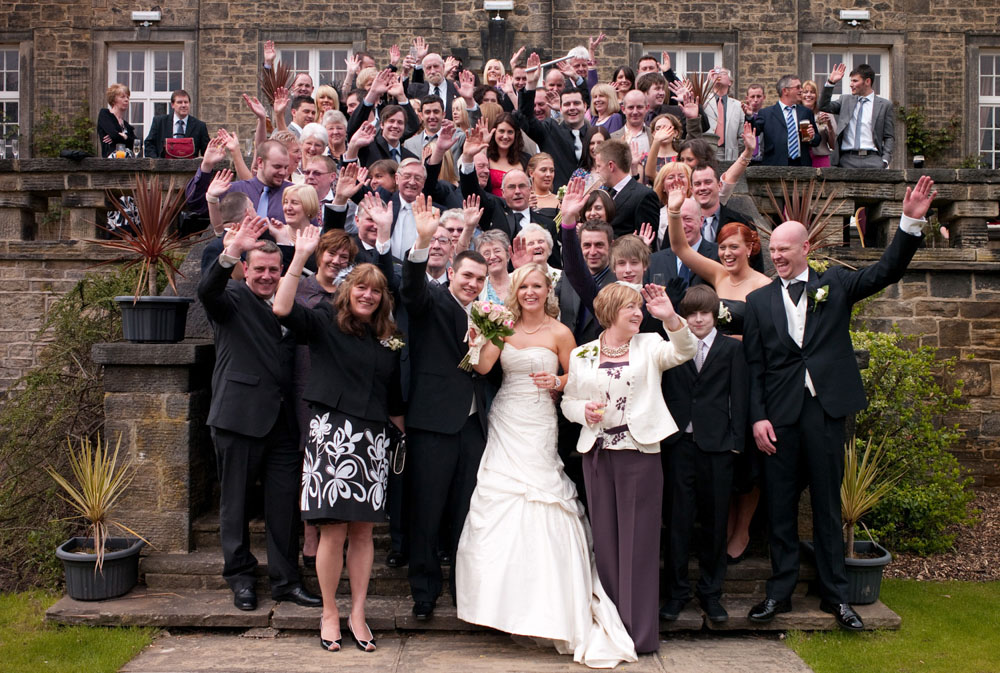 Everyone waves and smiles on the steps at Hoyle Court, West Yorkshire