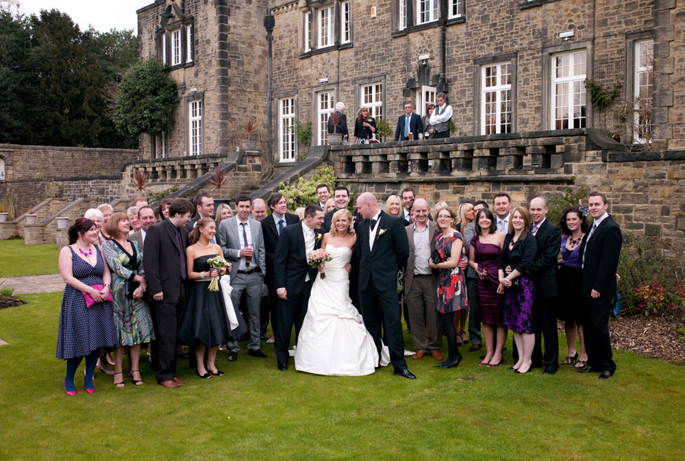 Friends gather on the lawn with Hoyle Court behind them in West Yorkshire