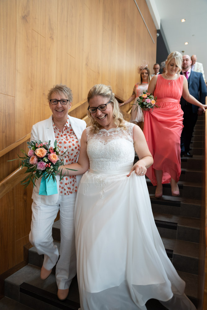The newlyweds and guests heading down the staircase