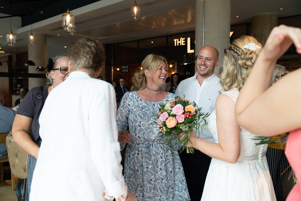 Guests and the couple gathering at The Lock bar in Leeds