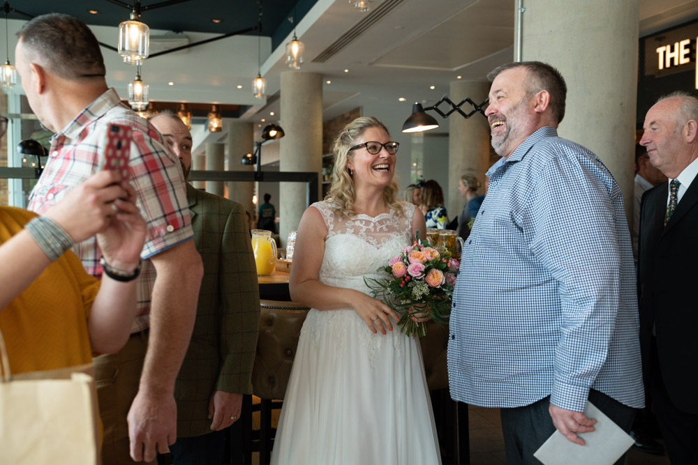 Guests smiling as they greet the couple