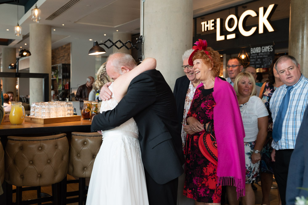 Tracey embraced by old friends