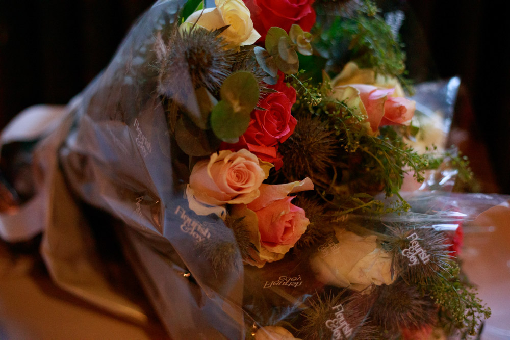 Gift bouquet for speeches on a wedding table at Lost & Found Leeds Club