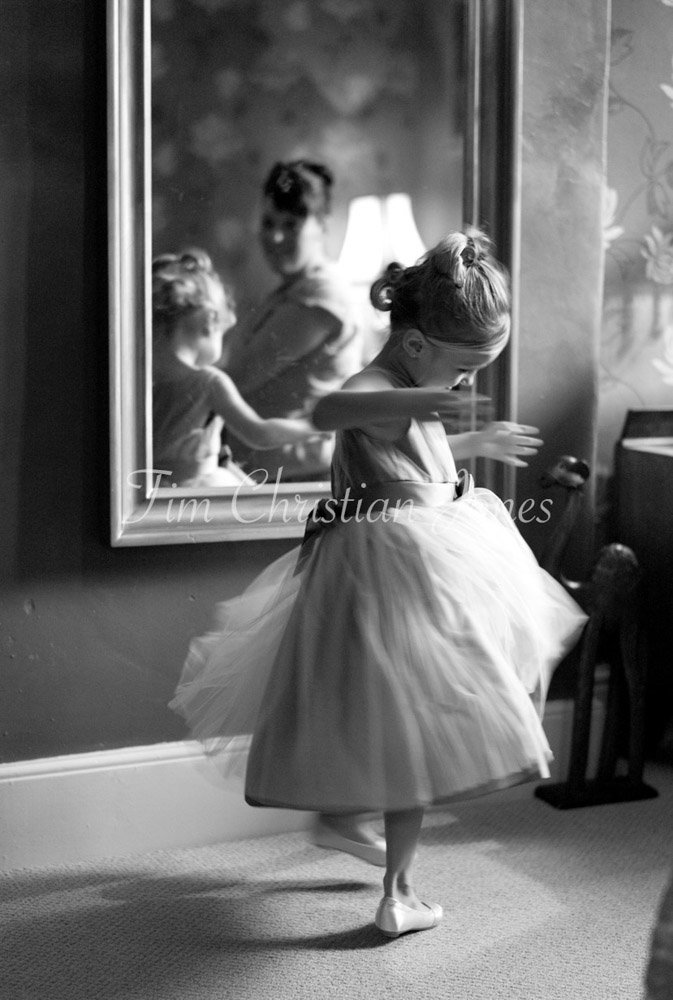 Bridesmaid twirling by the long mirror - Looking for a wedding photographer in Leeds?