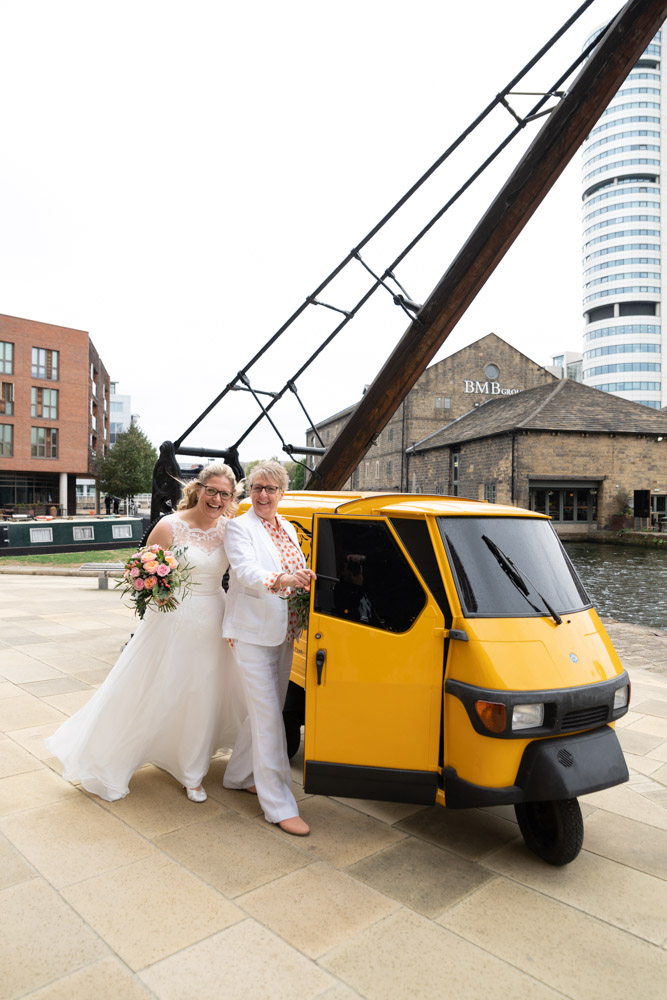 The couple smiling near the prosecco van