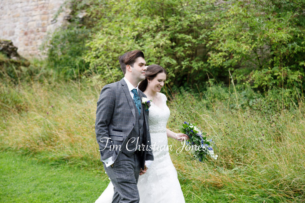 Yorkshire Wedding Romance at The Priest’s House – Jane & Callum 66 066 couple walking through long grass jc