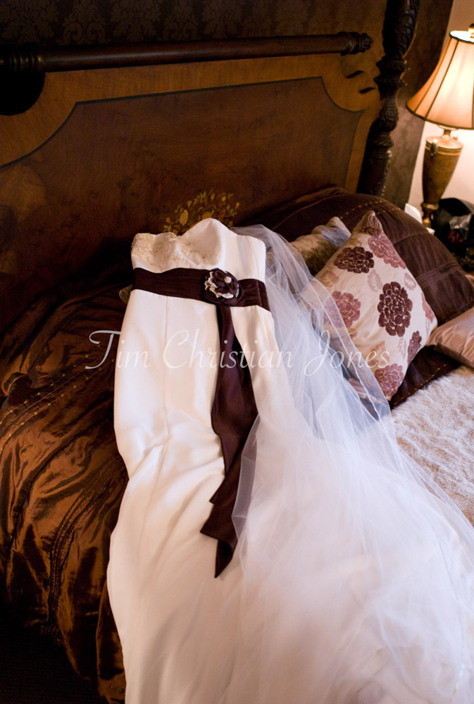 Bride's wedding dress placed on the bed - I'm a highly experienced Leeds, West Yorkshire wedding photographer covering the UK since 2004