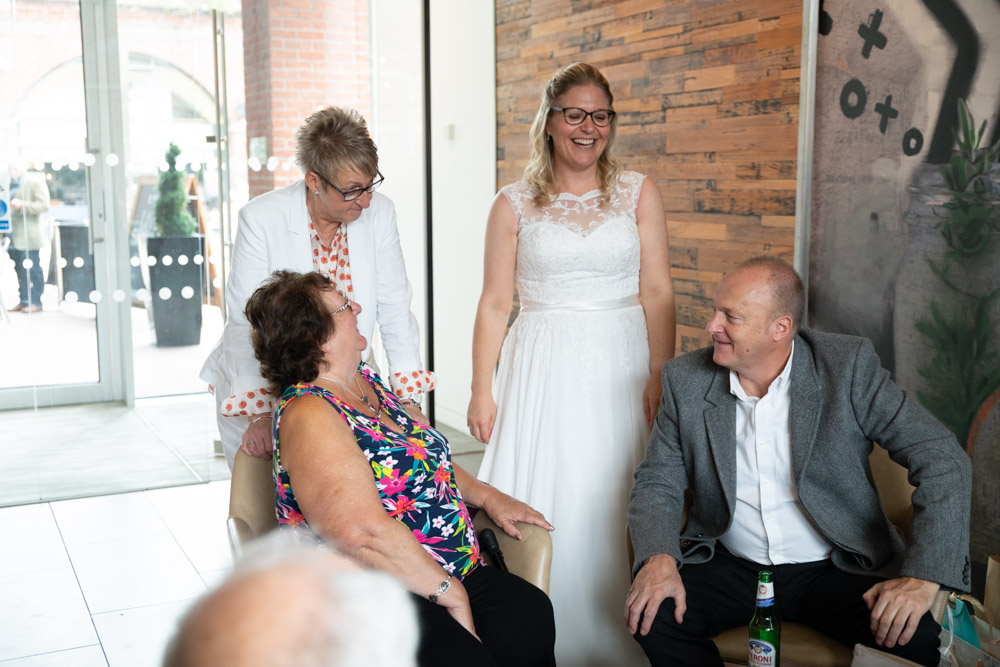 Clare and Tracey chatting with seated guests