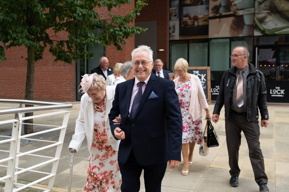 Guests walking outside with confetti in hand
