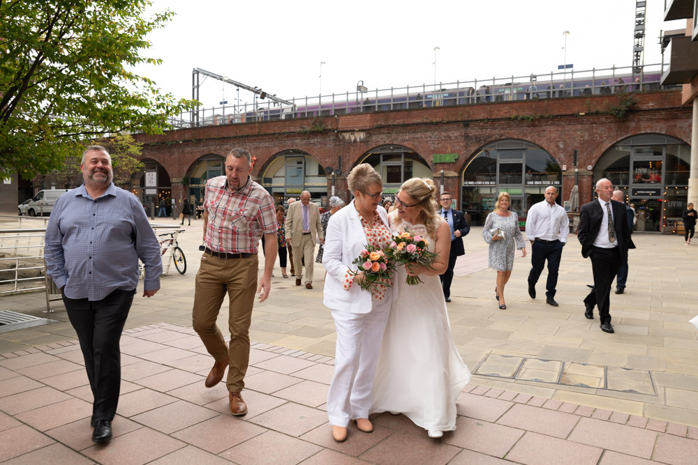 The couple slow as guests pass by
