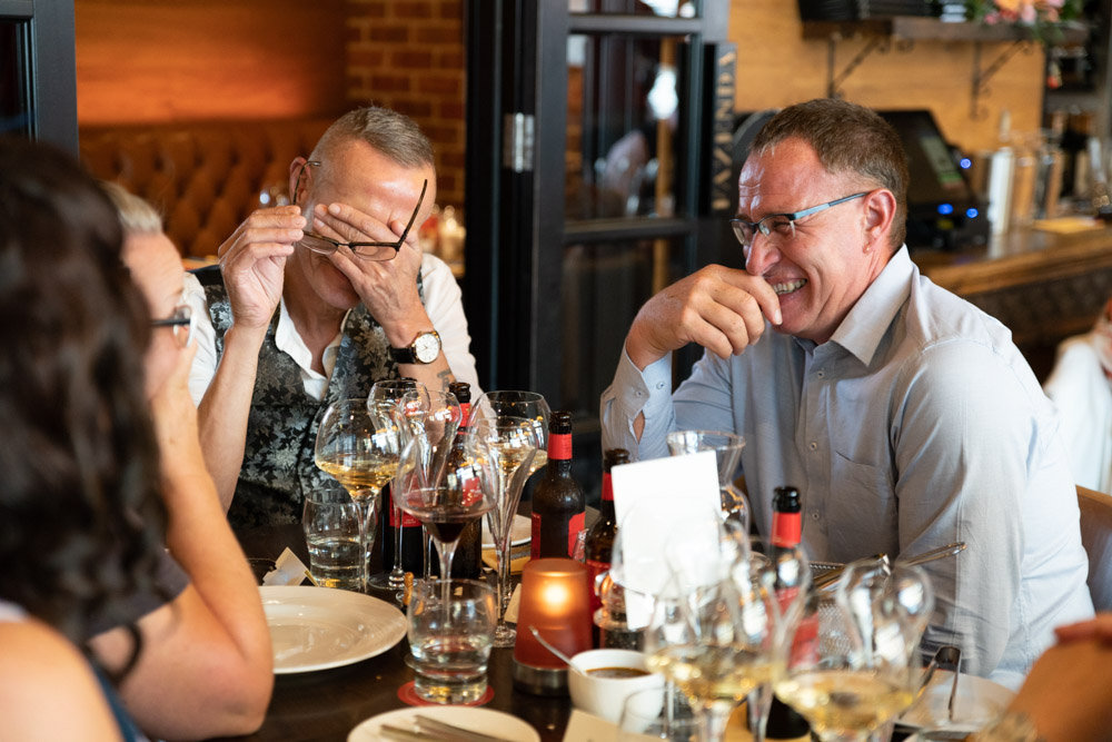Guests laughing in fits of joy