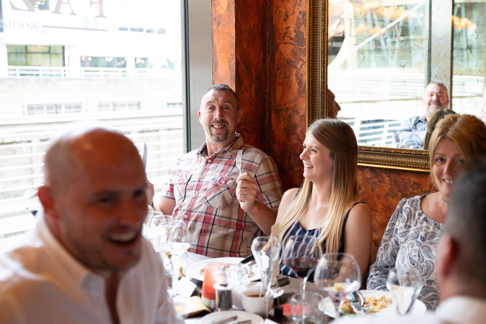 The “grumpy” guest jokingly holding knife and fork