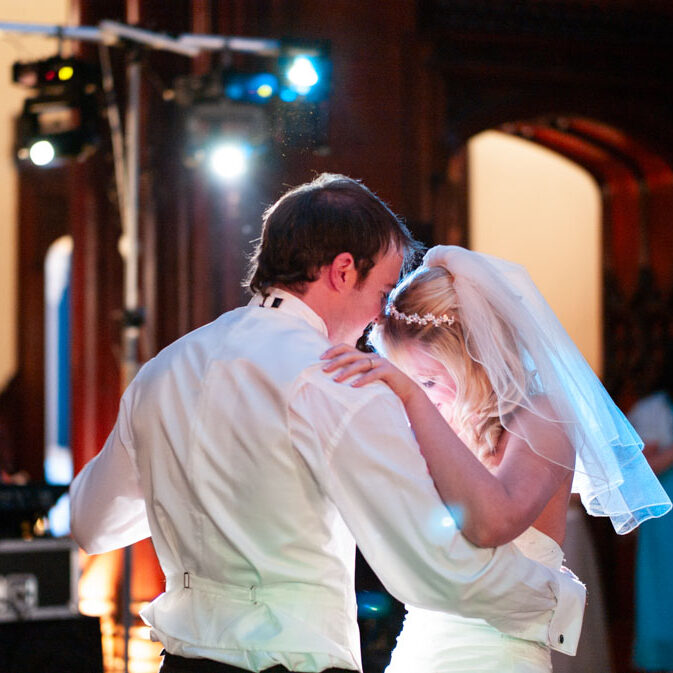 Vicky and Lee sharing their first dance at Allerton Castle near Leeds, captured in warm evening light.