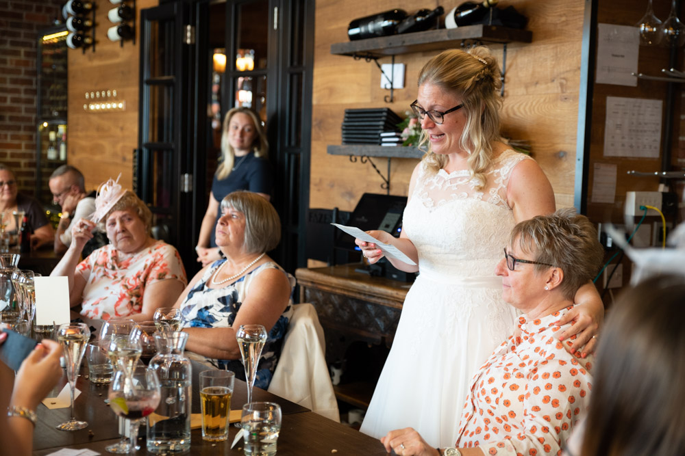 Tracey puts an arm around Clare as Table 1 looks on with emotion