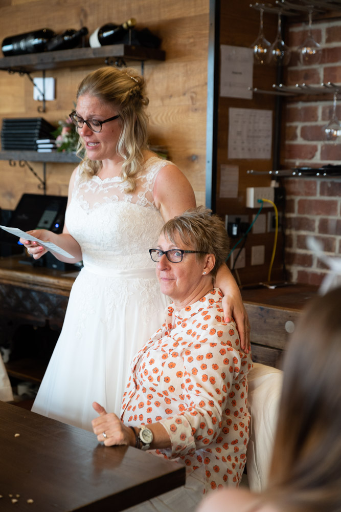 Tracey gives a cheerful thumbs-up to guests
