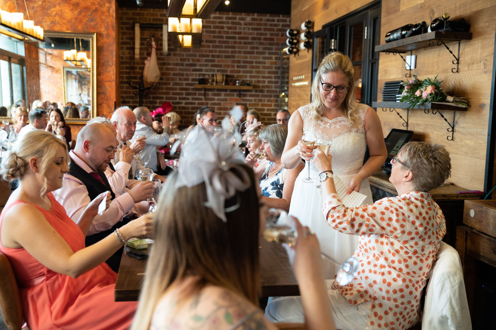 Tracey clinks glasses with guests at Fazenda Leeds