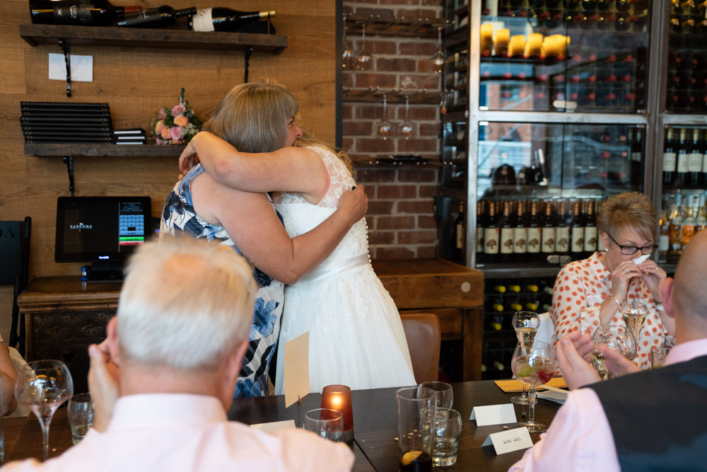 Clare hugs her mum after the speech