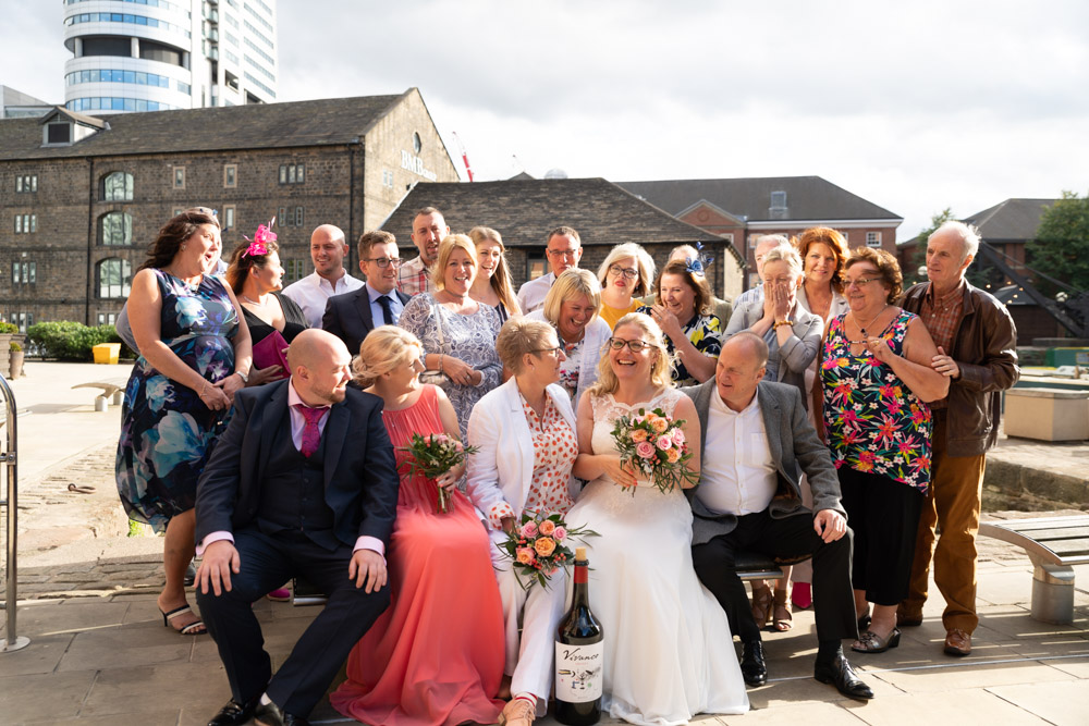 Guests in the large group photo chatting naturally with each other