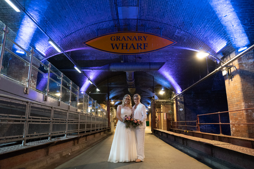 The couple in the Granary Wharf tunnel beneath the colour-changing lights