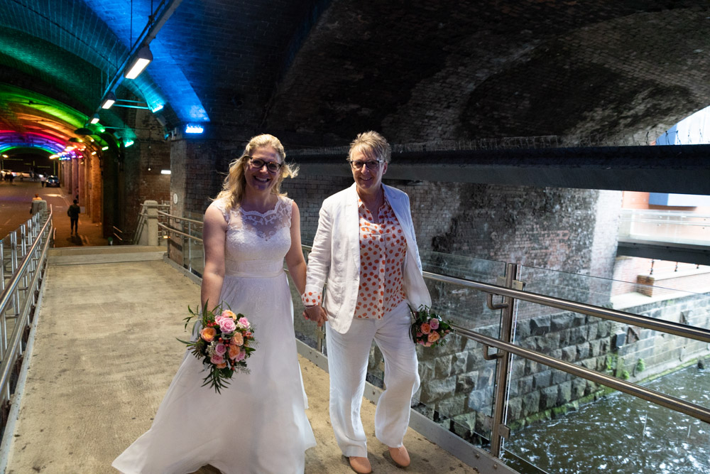 At the end of the Granary Wharf tunnel walkway, water flows beneath them