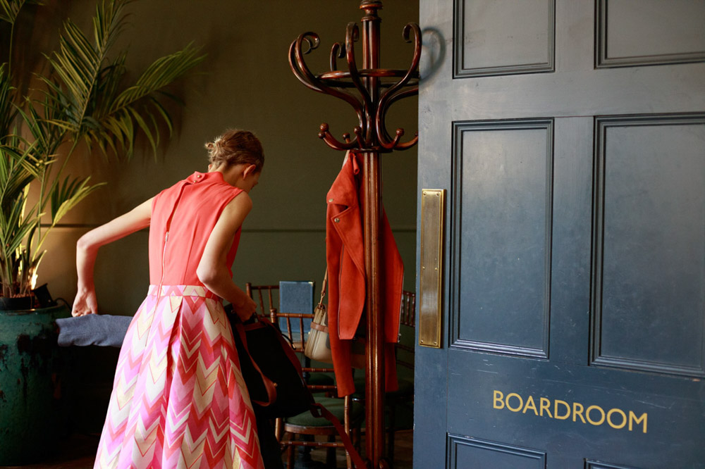 Bridesmaid leaves the boardroom with a soft smile
