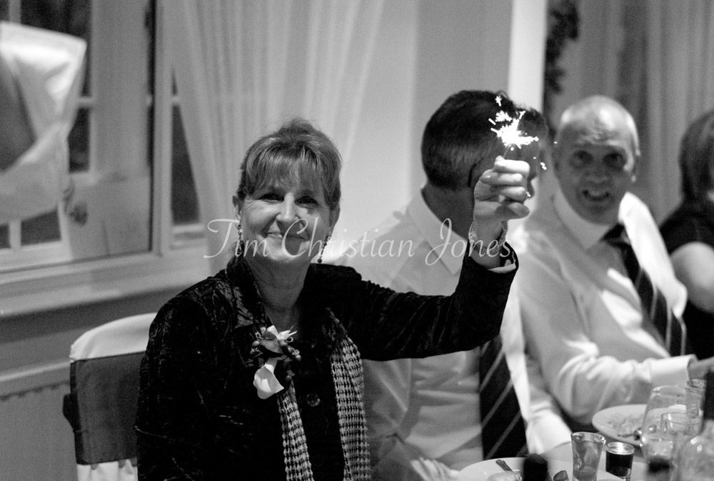 Groom's mom with a sparkler
