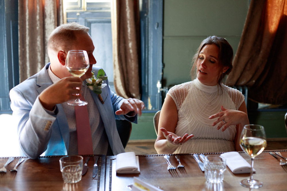 Wedding couple chatting during the meal at Lost & Found in Leeds