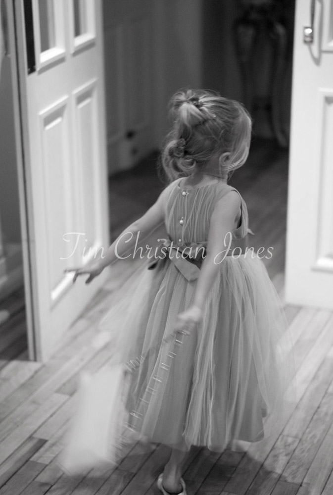 Bridesmaid breezing through a doorway