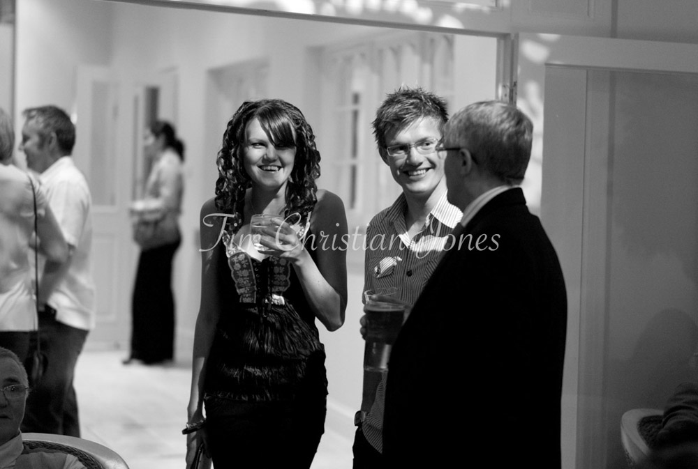 Guests chatting in B&W
